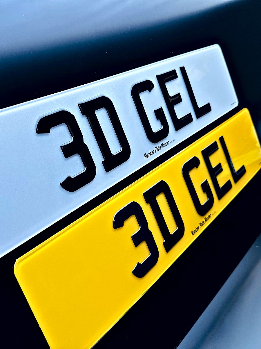 Close-up of white and yellow plates with domed gel letters