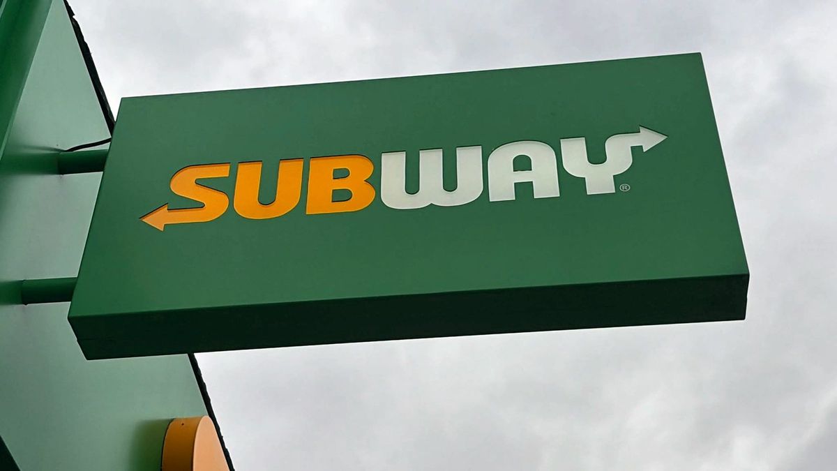 Subway projecting sign against the sky