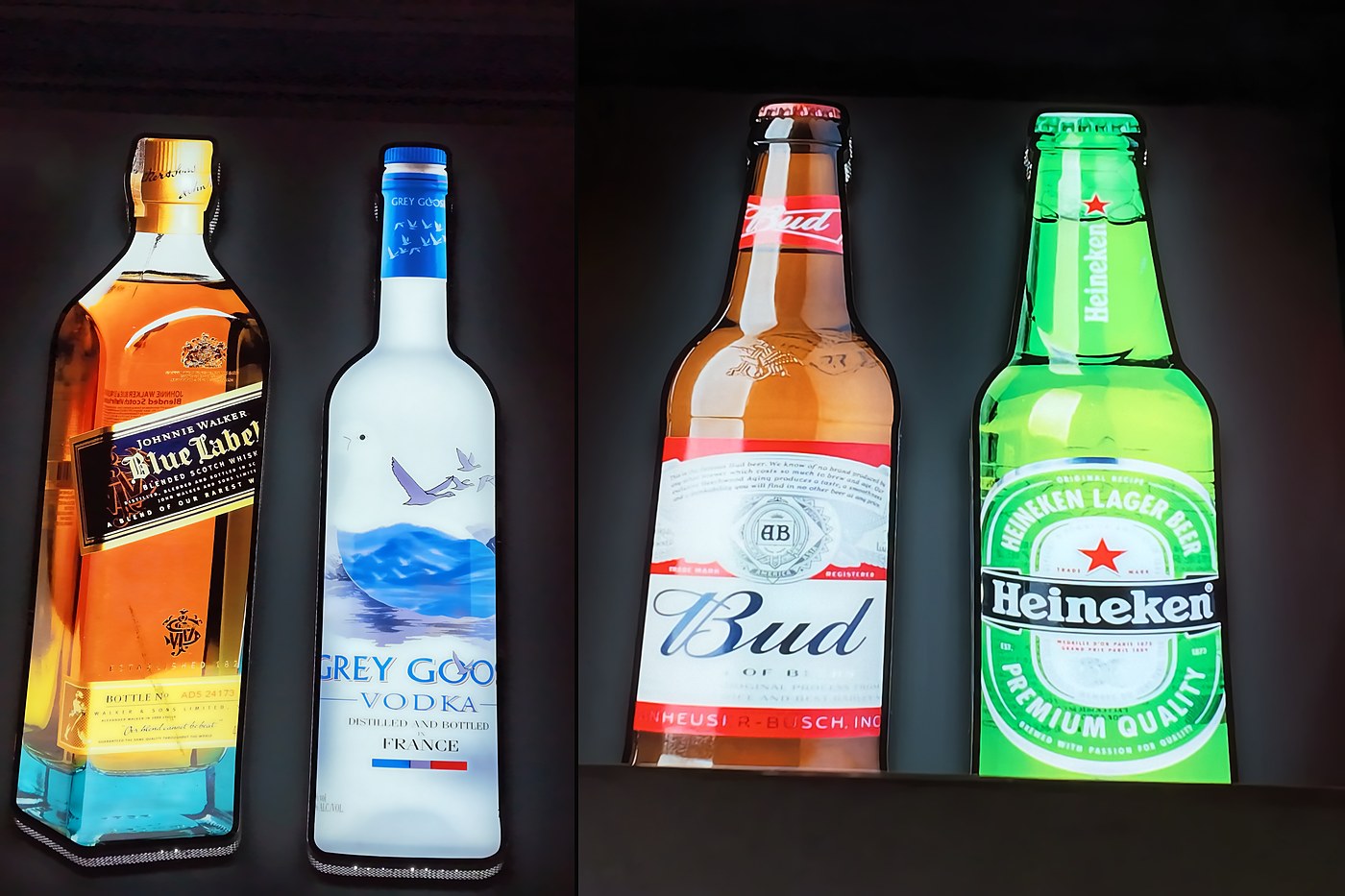 Bottle shaped light boxes we made for Harrow Local Food & Wine: whisky, vodka and beer bottles glowing on the shop wall